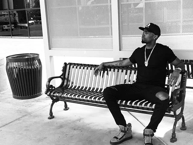 Chad Focus seated outdoors