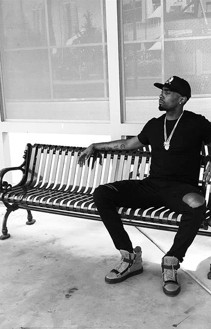Chad Focus seated in a black and white editorial portrait